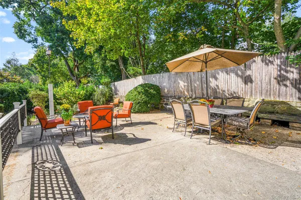 an outdoor space with furniture and umbrella