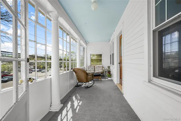 a living room with furniture and windows