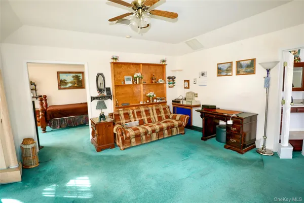 a bedroom with bed and window