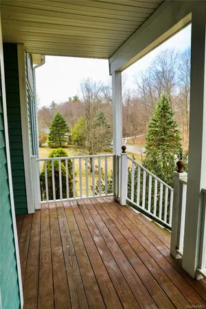 a balcony with wooden floor