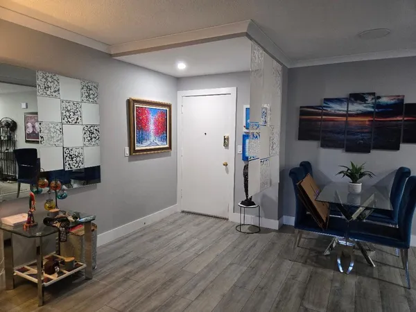 a room with furniture and wooden floor