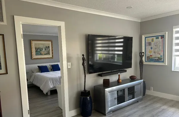 a view of living room with furniture and flat screen tv