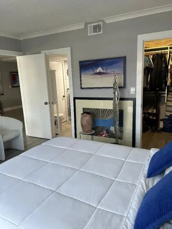 a room with a bed and a mirror