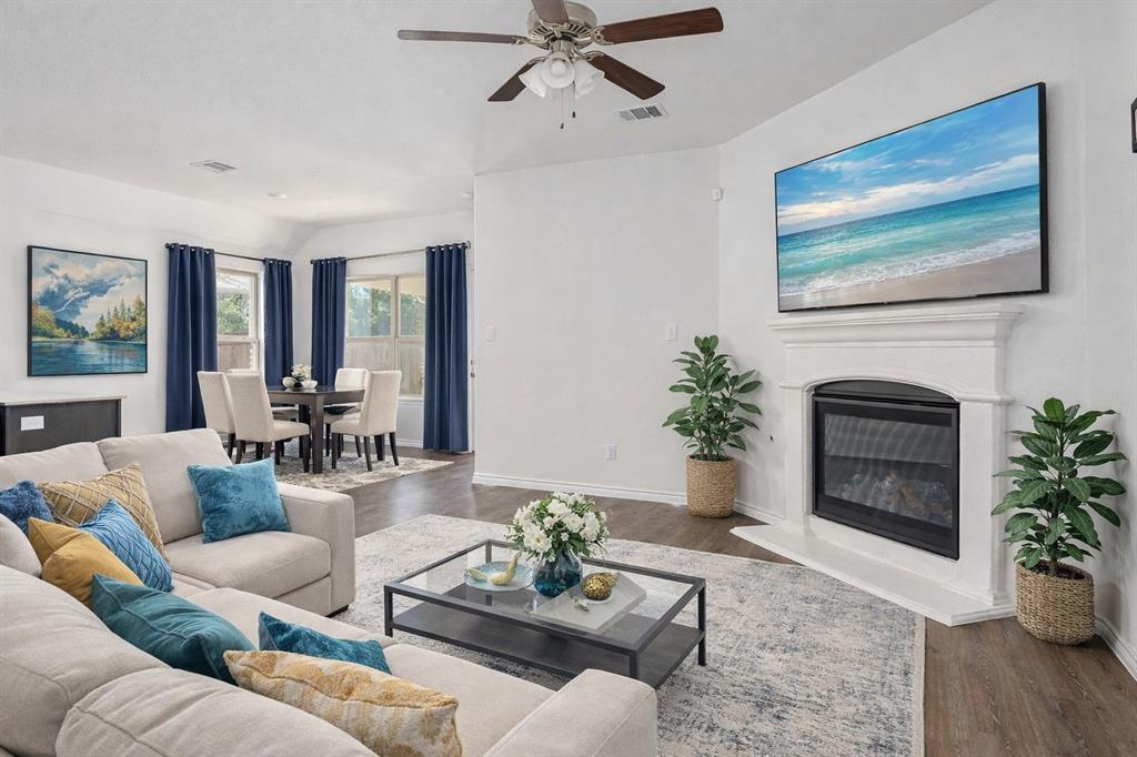 1500 Elizabeth Street Anna, TX 75409 - Photo 1 of 25 a living room with furniture a potted plant and a fireplace