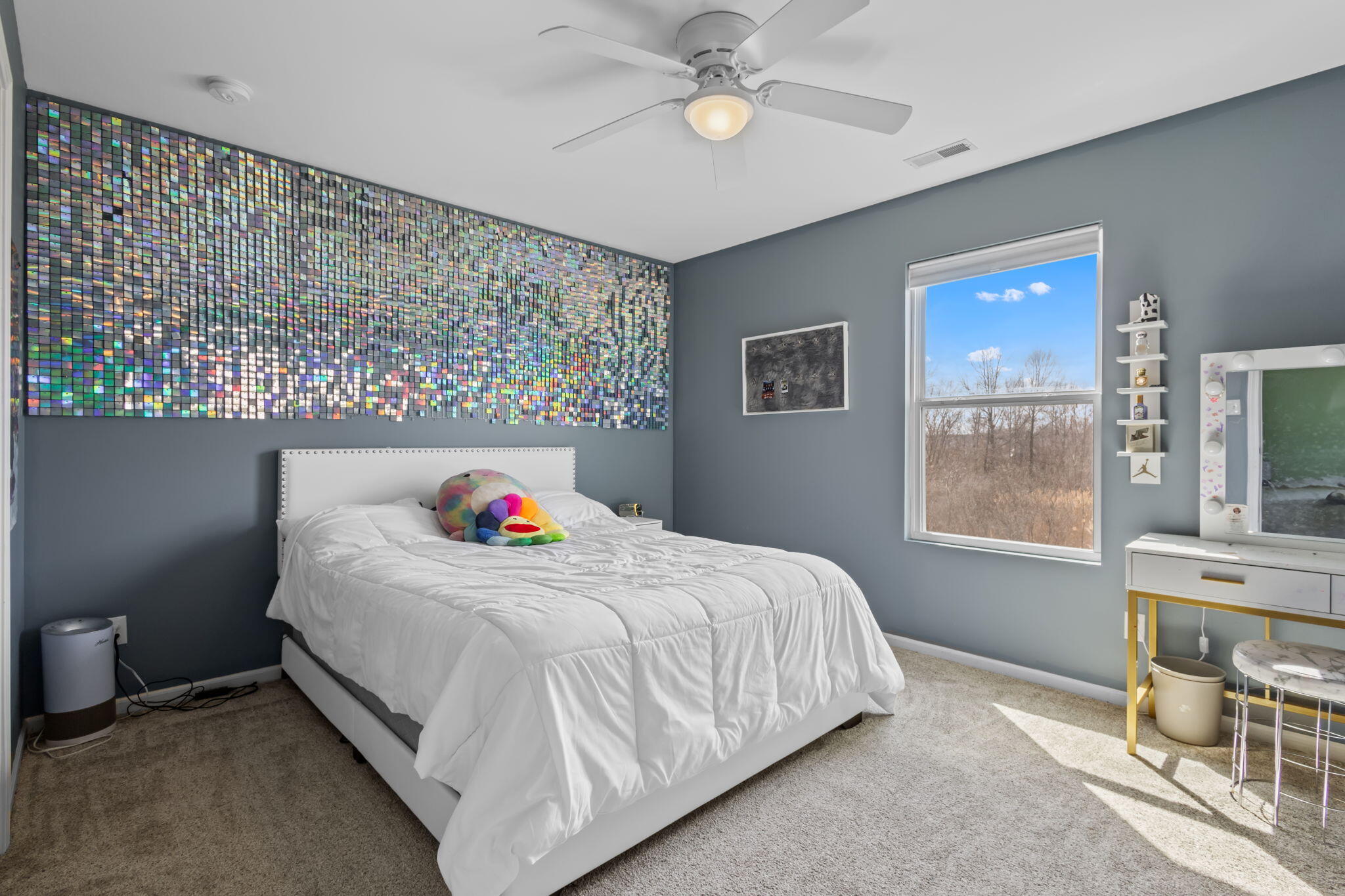 12938 Hayes Street Crown Point, IN 46307 - Photo 17 of 32 a bedroom with a bed and a chandelier