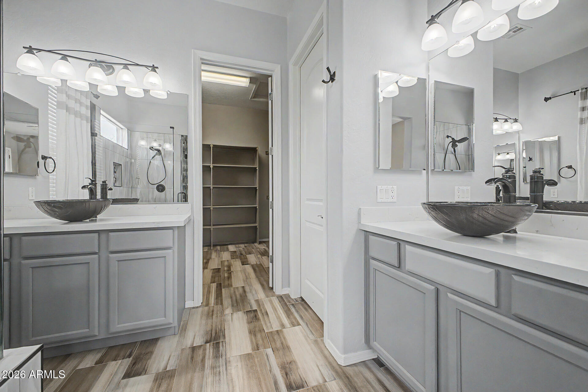 5090 South Ranger Trail Gilbert, AZ 85298 - Photo 17 of 50 a bathroom with a sink vanity and a mirror