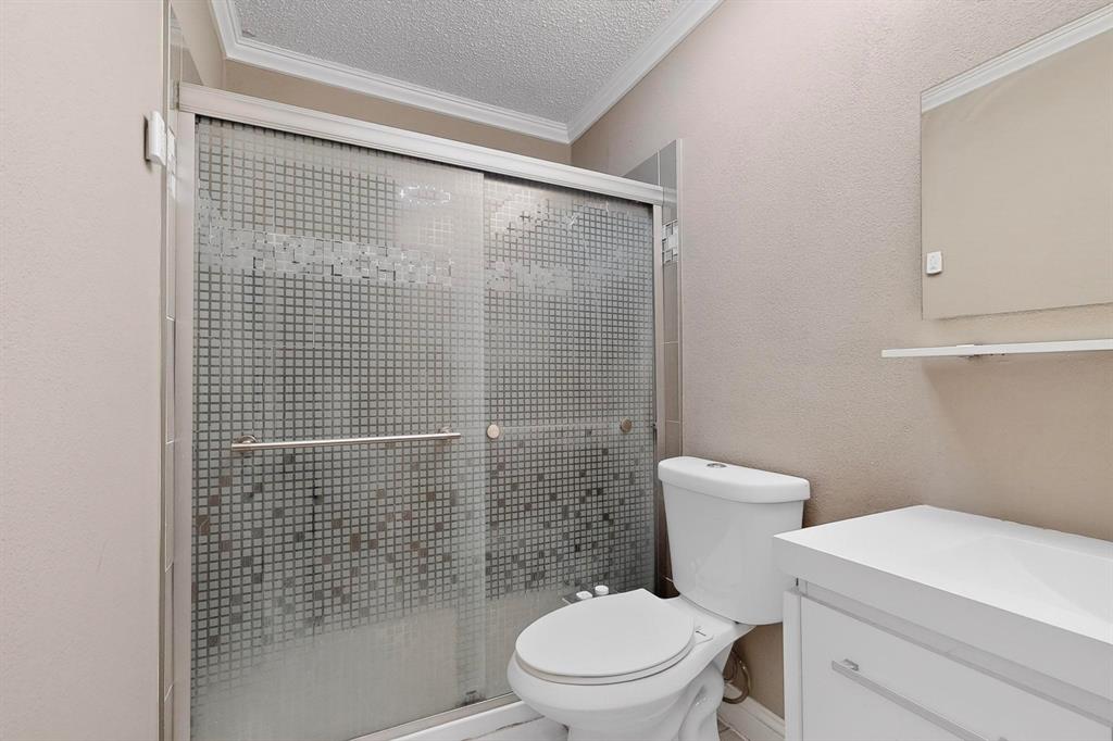 2200 East Trinity Mills Road, Unit 616 Carrollton, TX 75006 - Photo 18 of 25 a white toilet sitting next to a bathroom sink