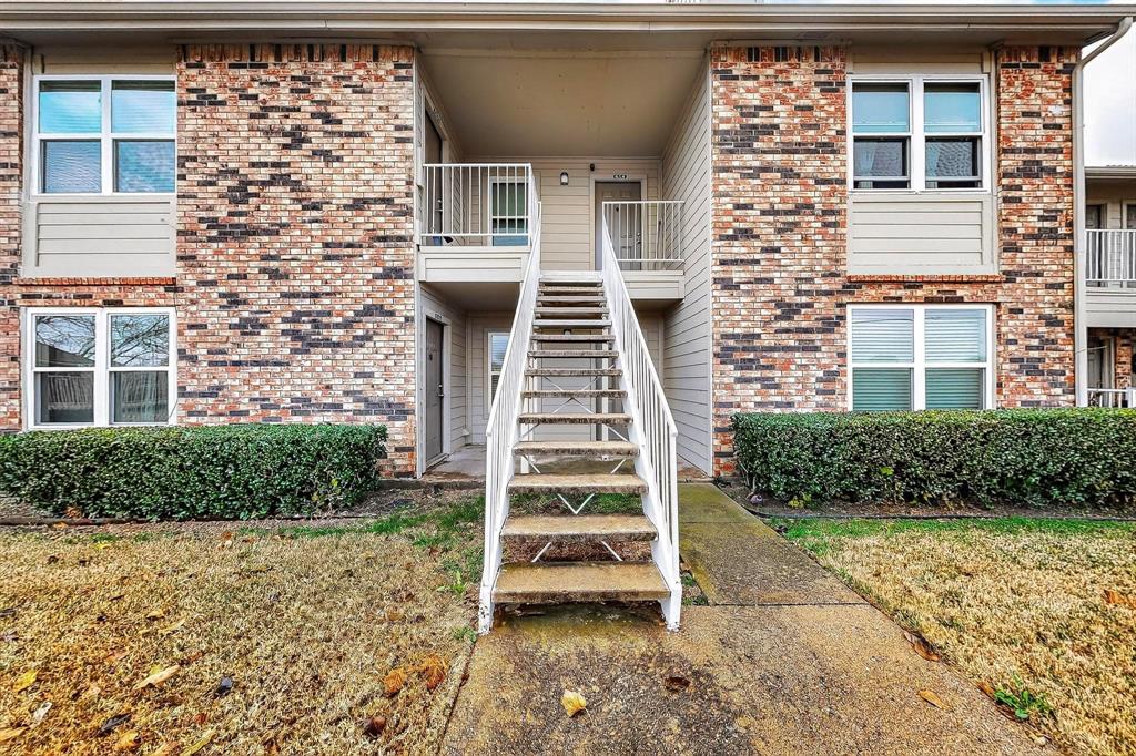 2200 East Trinity Mills Road, Unit 616 Carrollton, TX 75006 - Photo 24 of 25 front view of a house with a yard