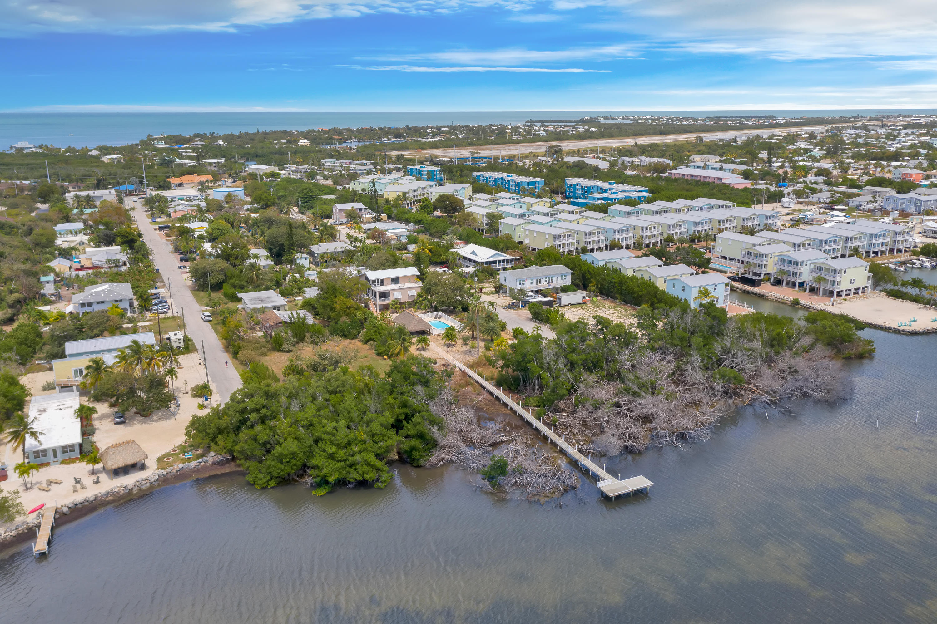 68th Street Marathon, FL 33050 - Photo 10 of 16 an aerial view of residential houses with outdoor space and ocean view