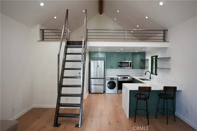 a room with furniture and wooden floor