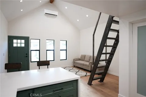 a view of a livingroom with furniture and window