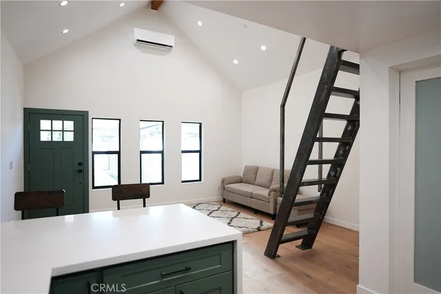 a view of a livingroom with furniture and window