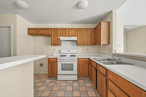 a bathroom with a granite countertop sink a mirror and a