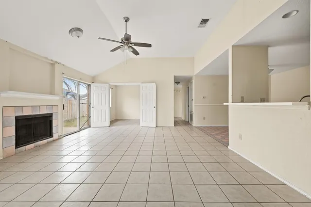a large kitchen with cabinets and furniture