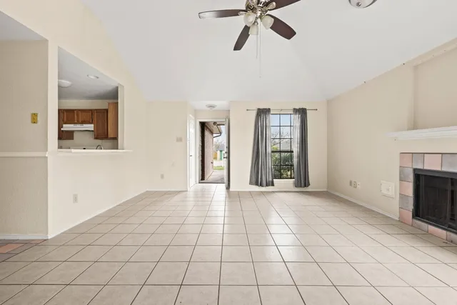 a front view of a house with a garden and yard