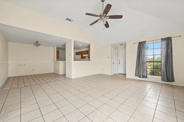 a view of an empty room with a fireplace