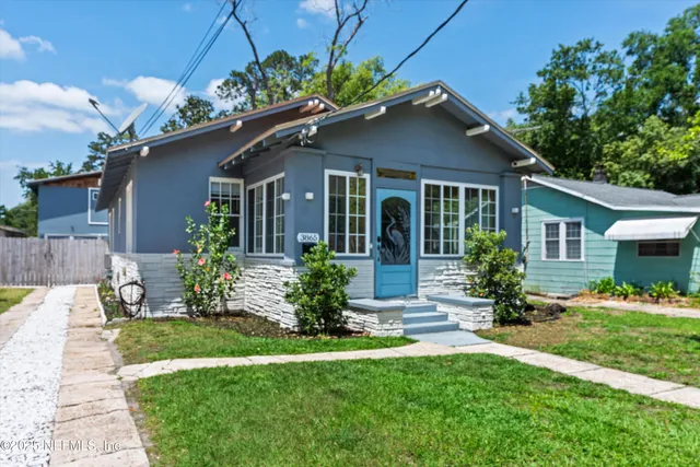 a front view of a house with a yard and porch