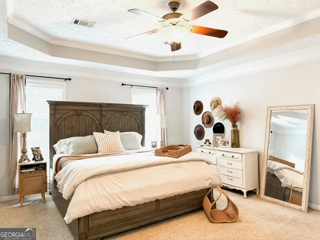 a bedroom with a bed and a walk in closet