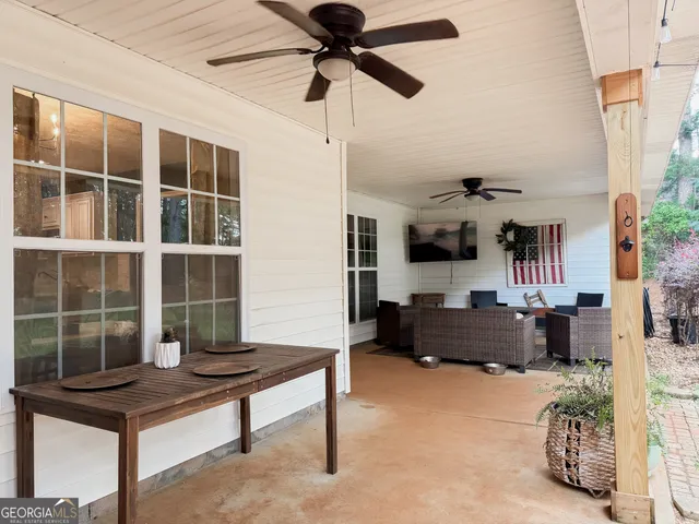 a bedroom with furniture and a window