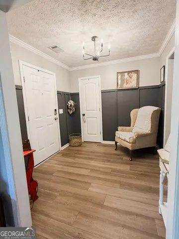 a spacious bedroom with a bed and a couch