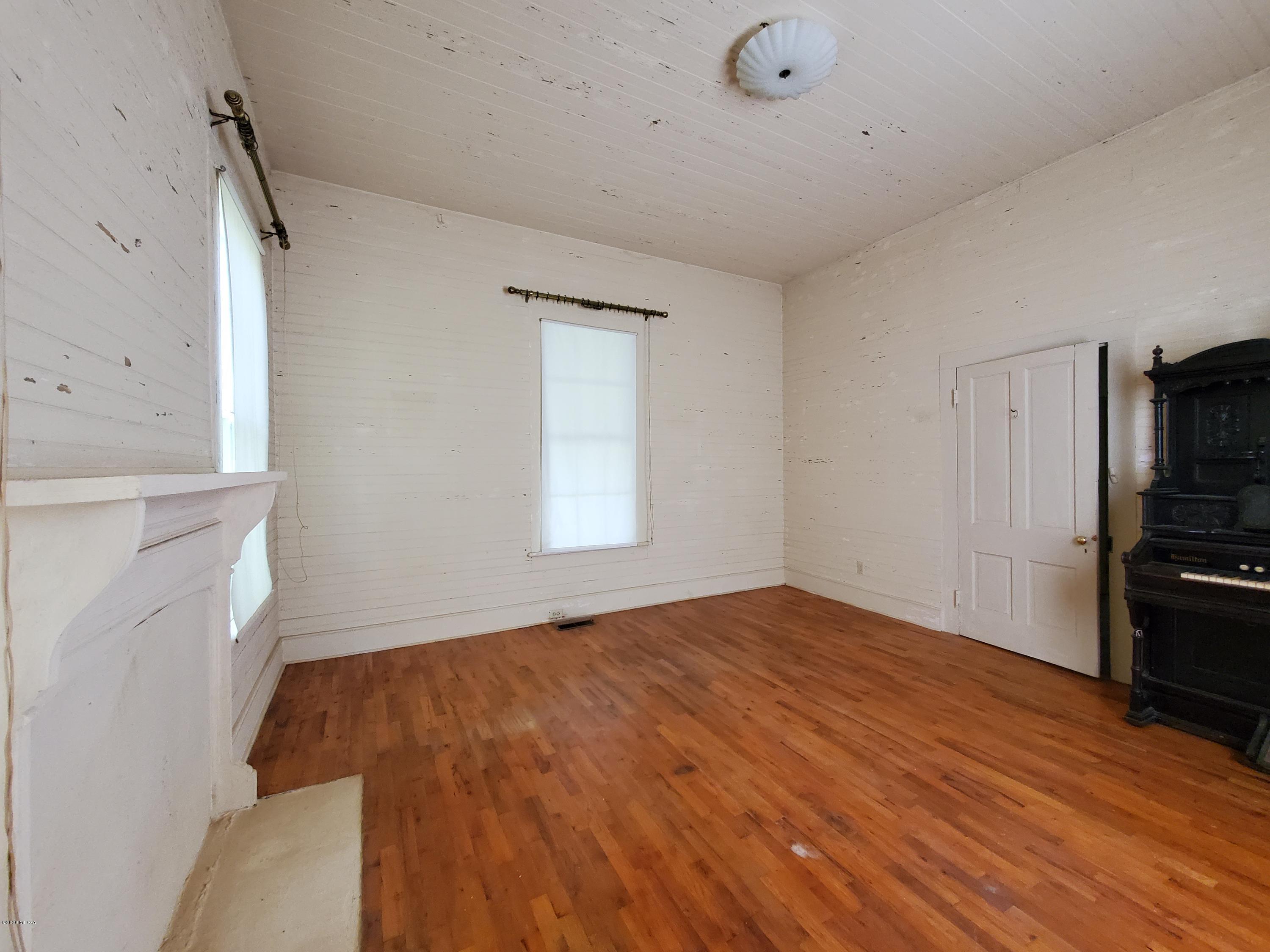 968 Rogers Church Road Forsyth, GA 31029 - Photo 11 of 14 a view of empty room with wooden floor and fan