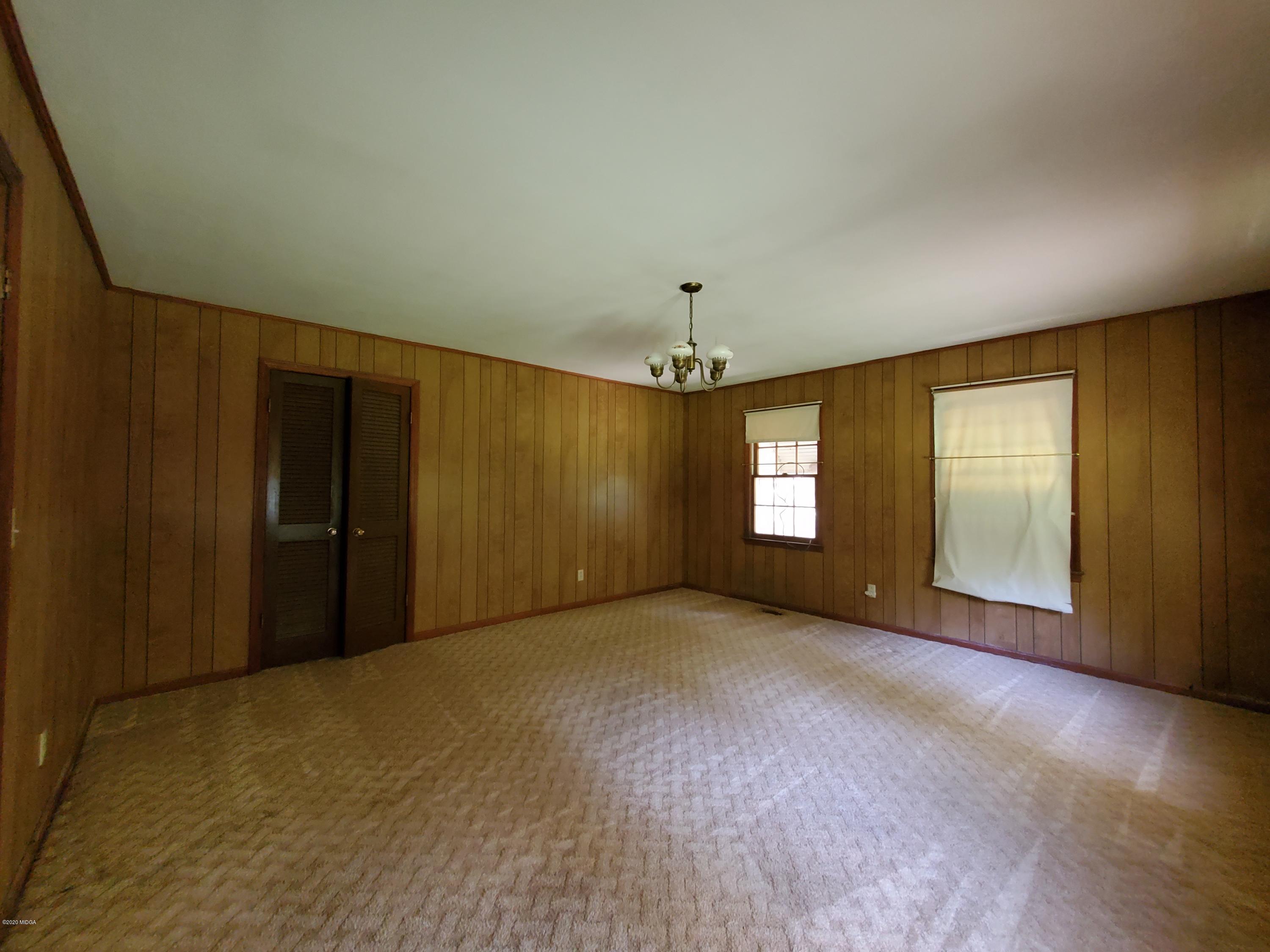 968 Rogers Church Road Forsyth, GA 31029 - Photo 12 of 14 an empty room with windows and entrance