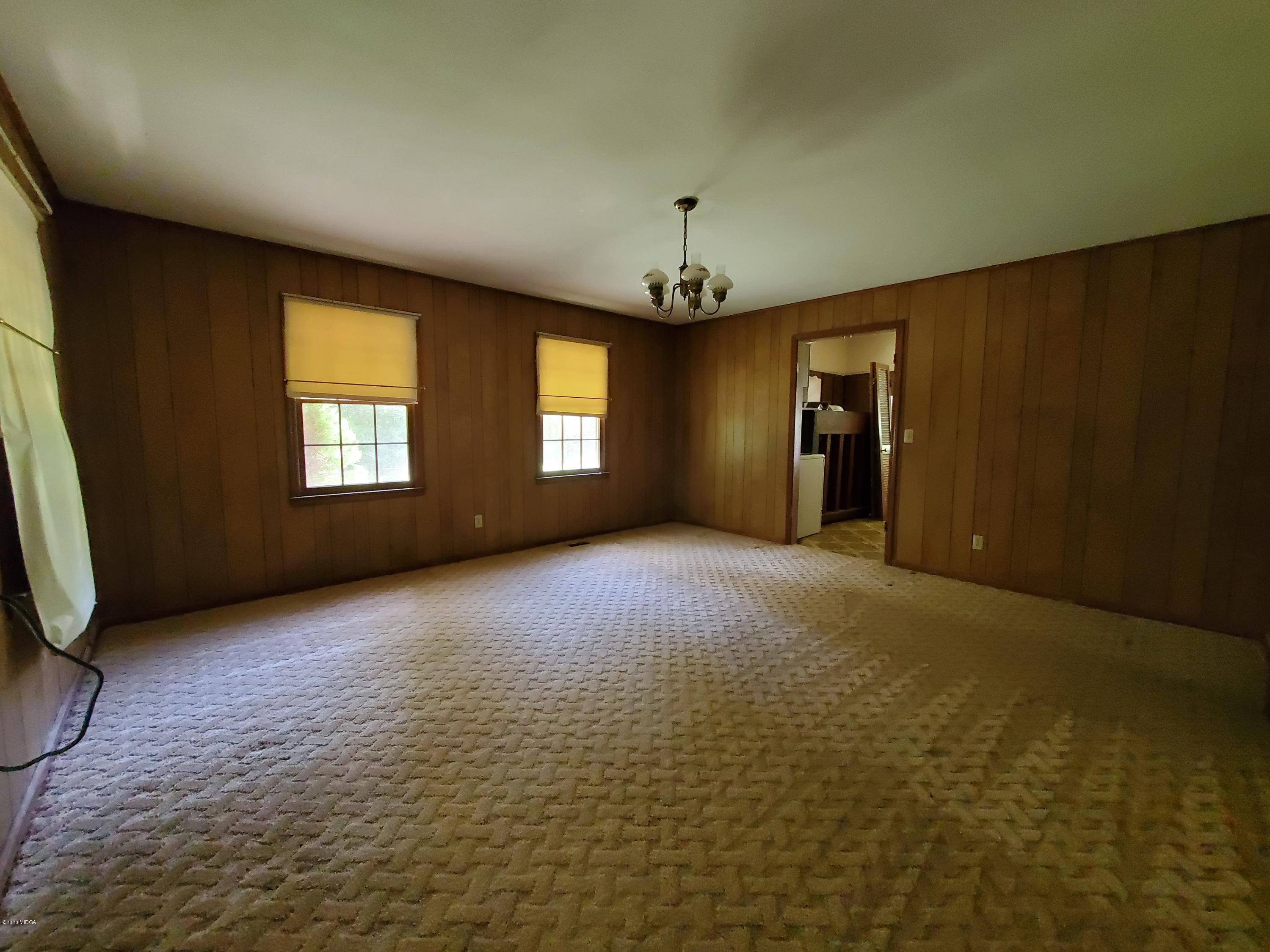 968 Rogers Church Road Forsyth, GA 31029 - Photo 13 of 14 an empty room with windows and entrance