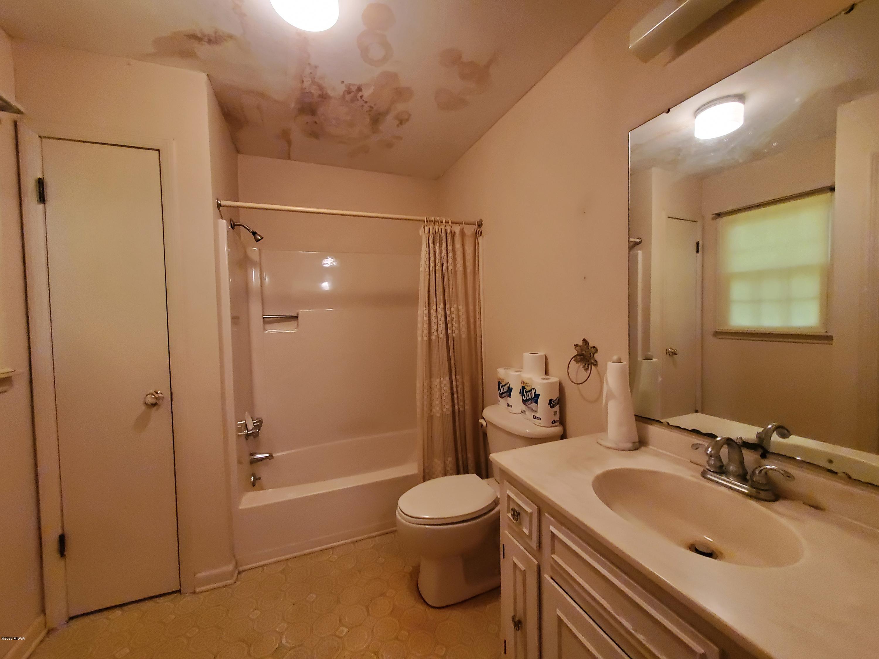 968 Rogers Church Road Forsyth, GA 31029 - Photo 14 of 14 a bathroom with a sink toilet and shower