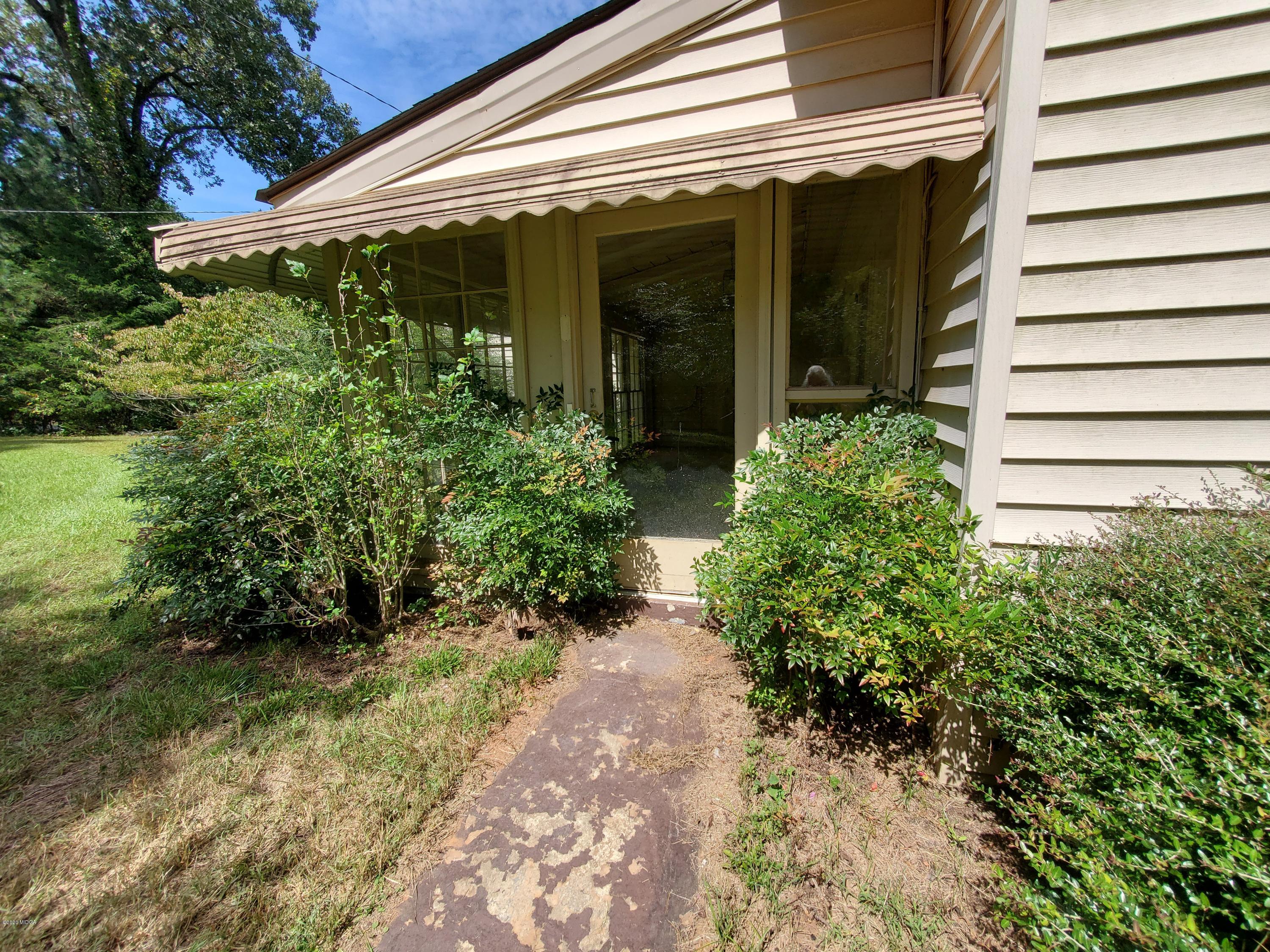 968 Rogers Church Road Forsyth, GA 31029 - Photo 4 of 14 a view of a pathway with potted plants