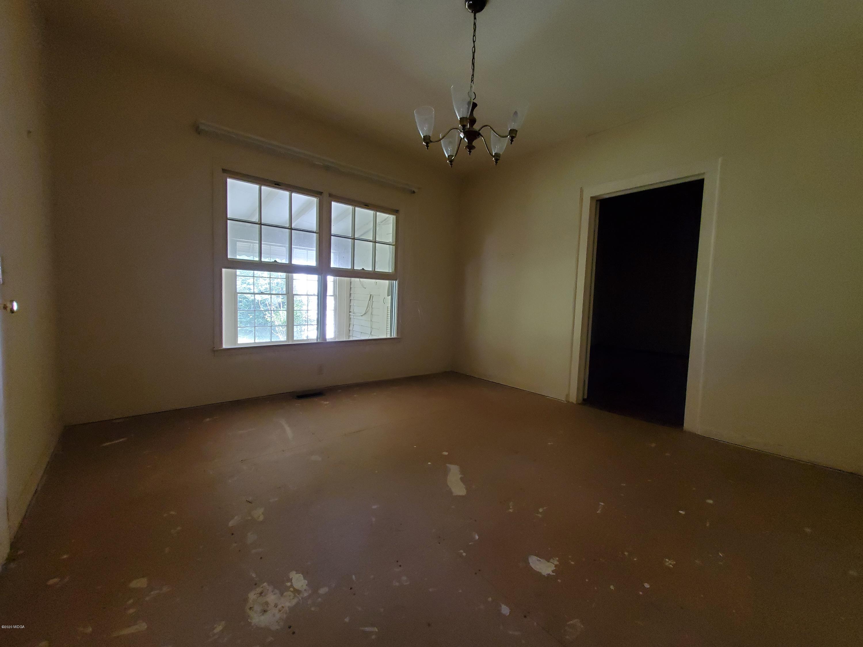 968 Rogers Church Road Forsyth, GA 31029 - Photo 6 of 14 a view of an empty room with a window