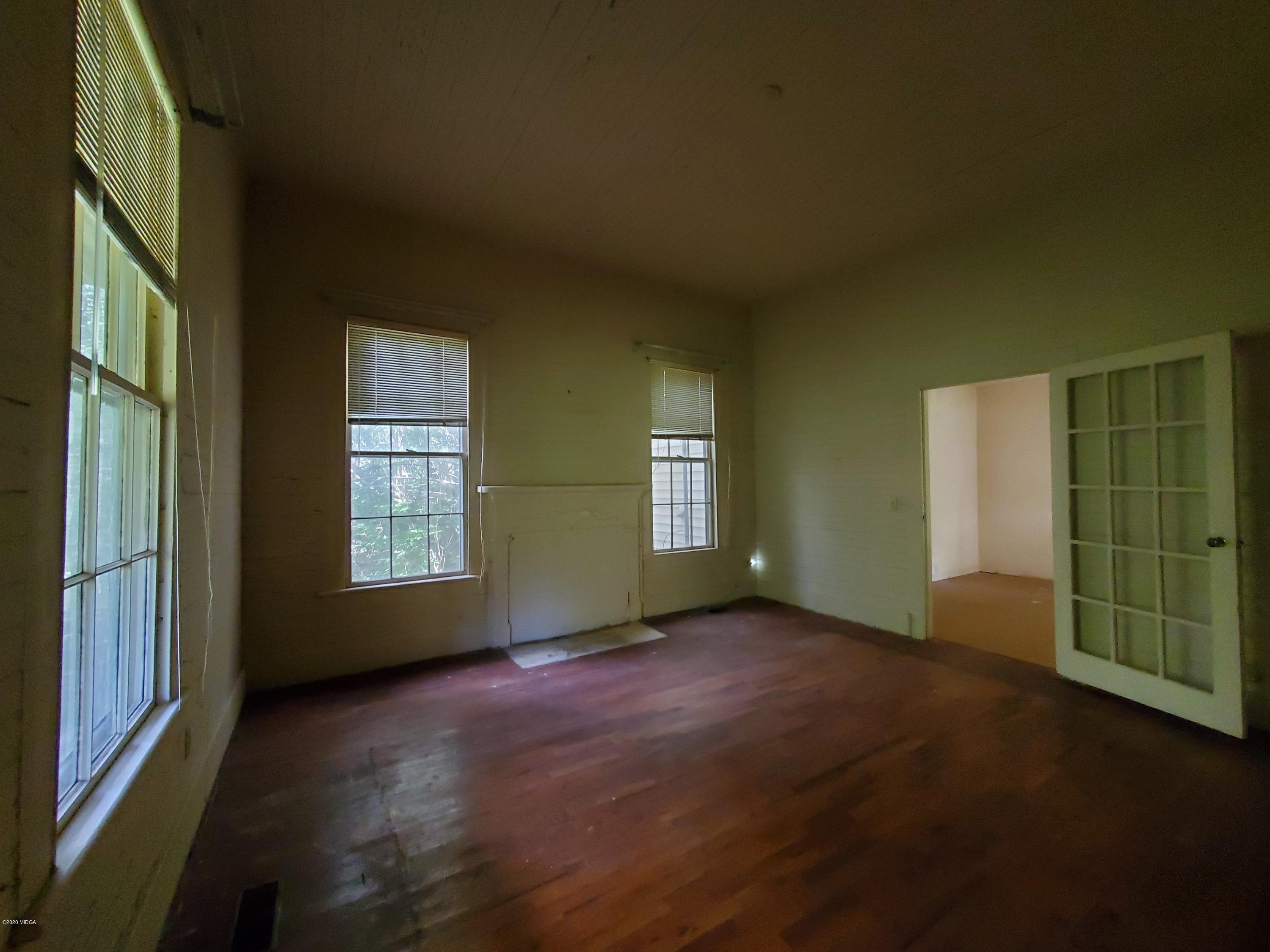 968 Rogers Church Road Forsyth, GA 31029 - Photo 8 of 14 an empty room with windows