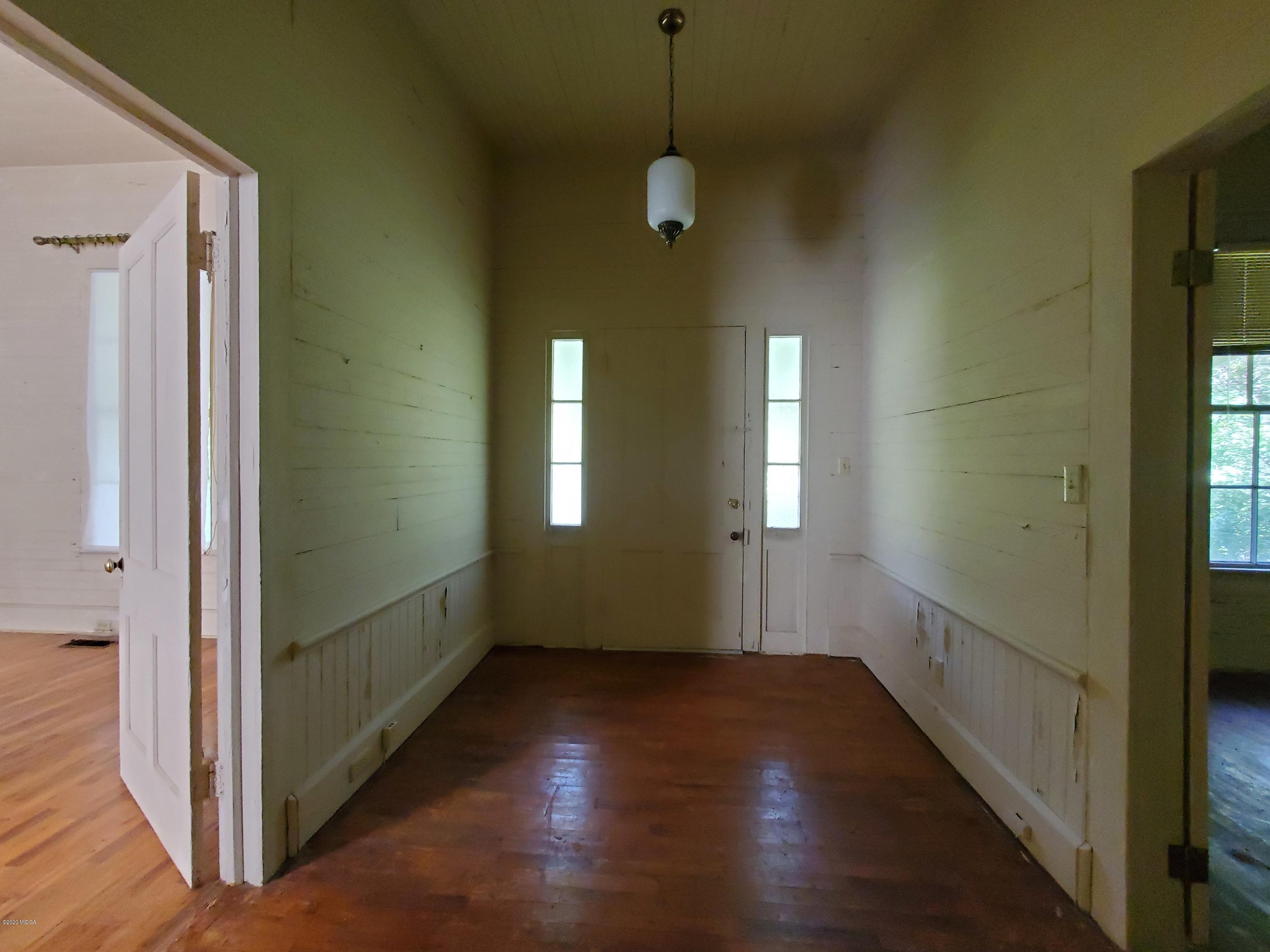 968 Rogers Church Road Forsyth, GA 31029 - Photo 9 of 14 a view of a room with wooden floor and windows