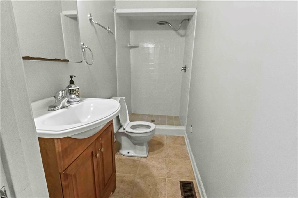 2314 Wayside Drive Brookhaven, GA 30319 - Photo 12 of 17 a bathroom with a sink a toilet and shower