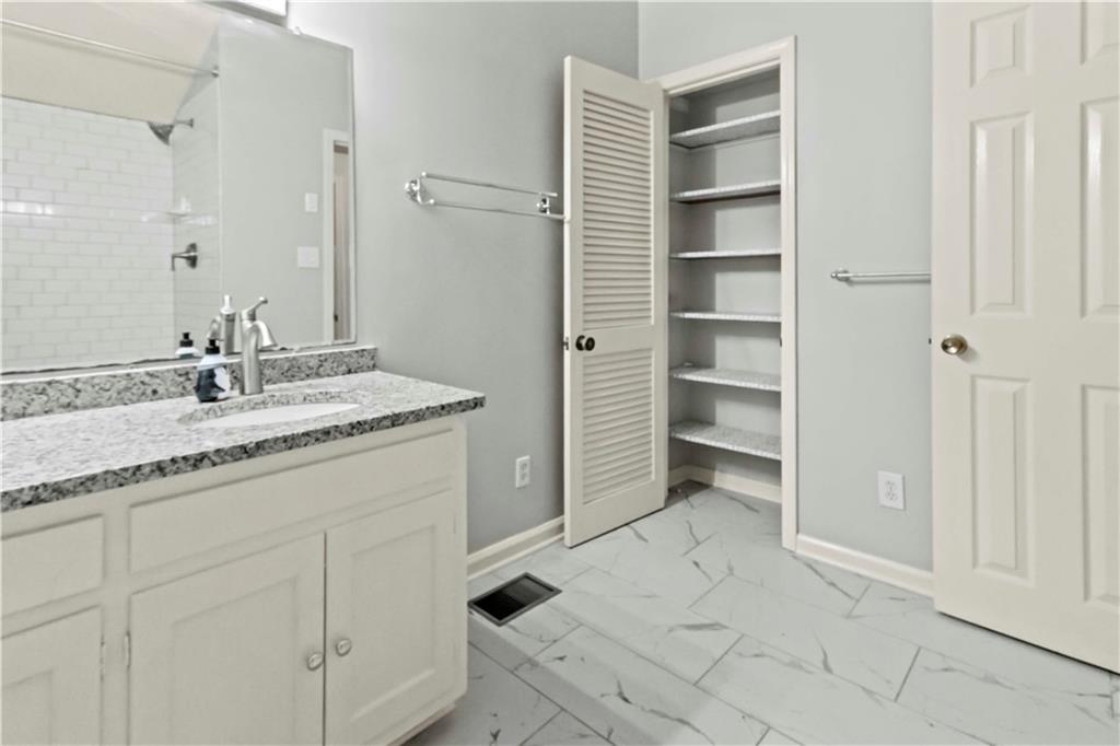 2314 Wayside Drive Brookhaven, GA 30319 - Photo 13 of 17 a bathroom with a granite countertop sink and a mirror