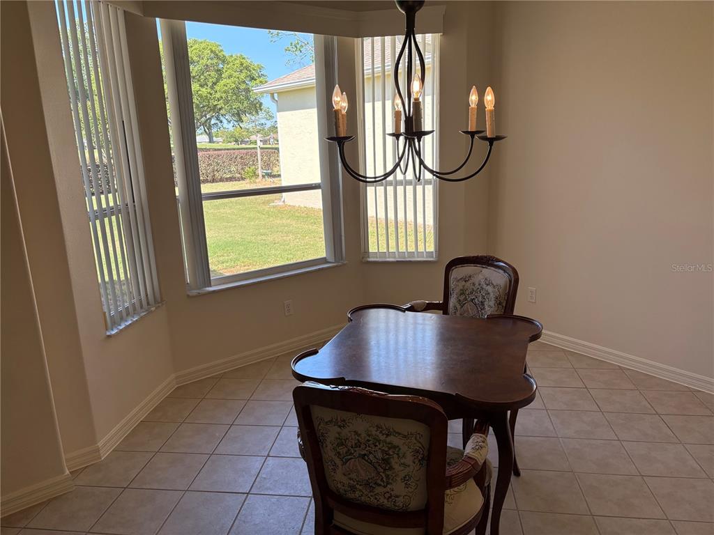 9288 Southwest 93rd Circle Ocala, FL 34481 - Photo 8 of 24 a living room with furniture and a window