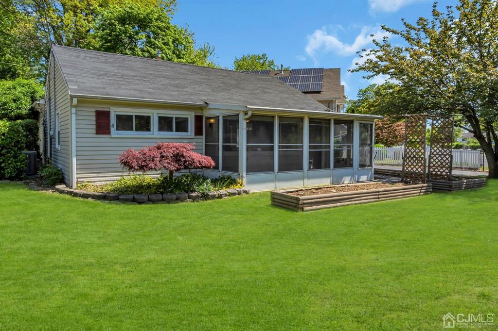462 Old Post Road Edison, NJ 08817 - Photo 1 of 19 a front view of a house with a yard and porch