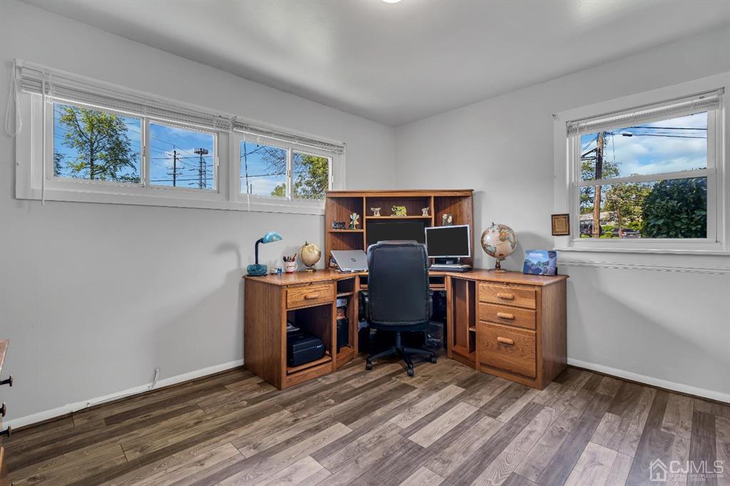 462 Old Post Road Edison, NJ 08817 - Photo 14 of 19 a view of workspace with wooden floor ceiling fan and windows
