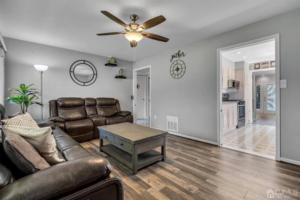 462 Old Post Road Edison, NJ 08817 - Photo 5 of 19 a living room with furniture and a wooden floor