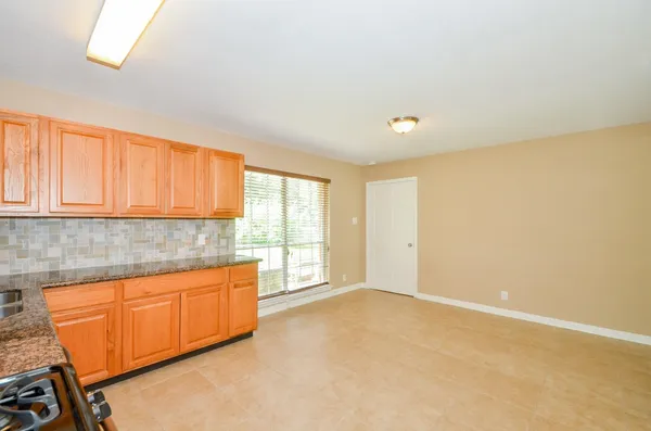 a room with a sink and cabinets