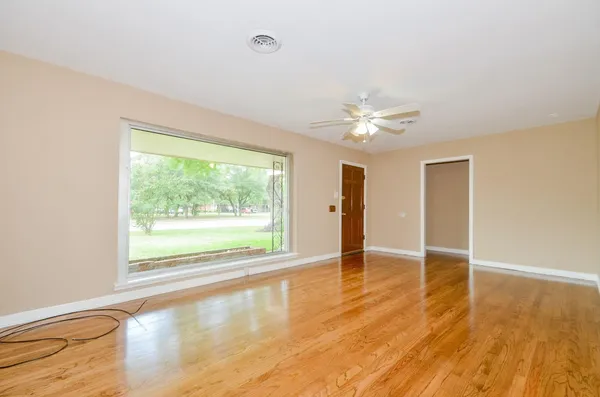 a view of an empty room with a window