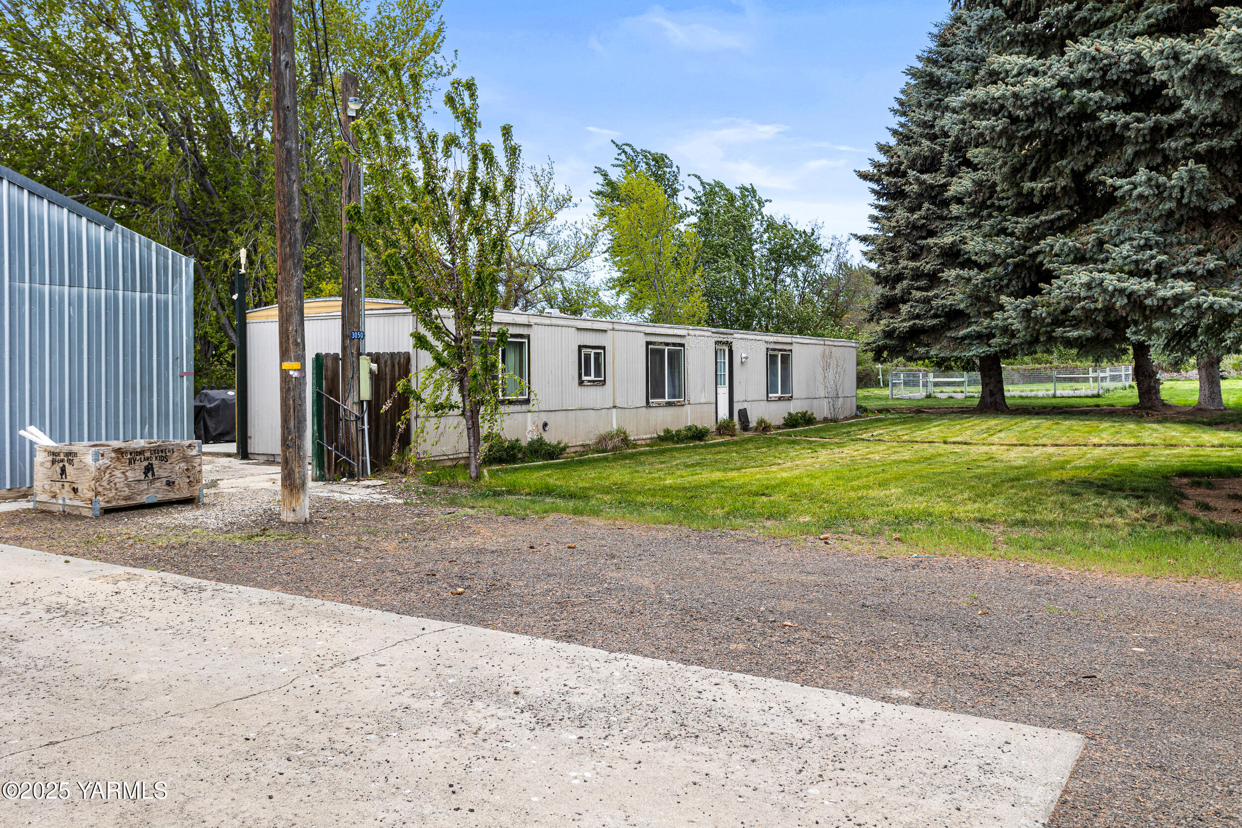 3050 Rosenkranz Road Tieton, WA 98947 - Photo 3 of 28 a house with yard in front of it