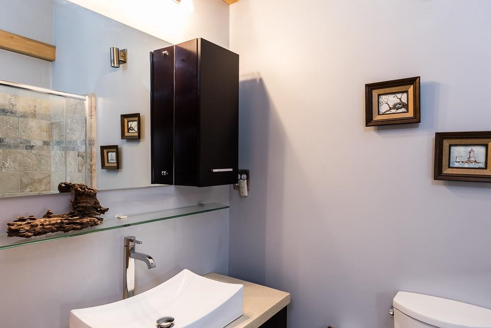 3604 Laurel Circle Raleigh, NC 27612 - Photo 17 of 59 a bathroom with a sink and a mirror