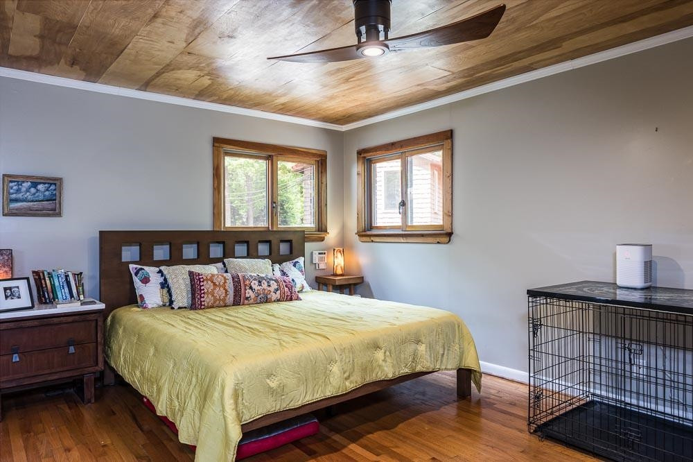 3604 Laurel Circle Raleigh, NC 27612 - Photo 18 of 59 a bedroom with a bed and wooden floor