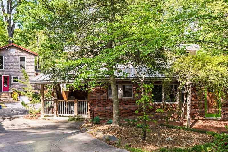 3604 Laurel Circle Raleigh, NC 27612 - Photo 5 of 59 front view of a house with a tree