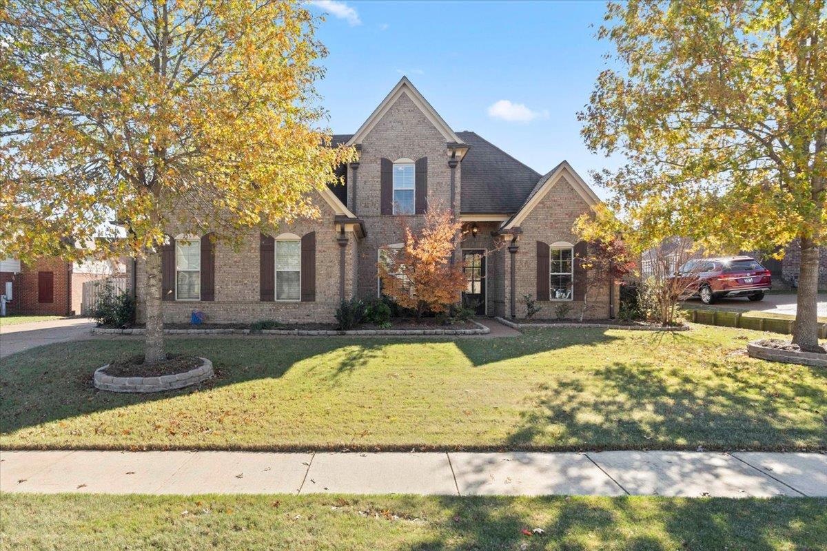 225 Estanaula Road Collierville, TN 38017 - Photo 1 of 38 a view of a white house with a yard