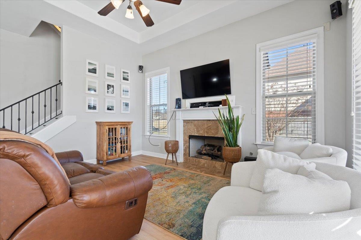 225 Estanaula Road Collierville, TN 38017 - Photo 16 of 38 a living room with furniture a fireplace and a flat screen tv