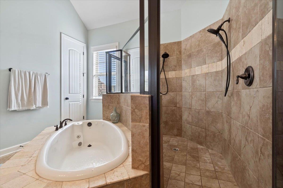 225 Estanaula Road Collierville, TN 38017 - Photo 20 of 38 a bathroom with a sink a shower and a mirror