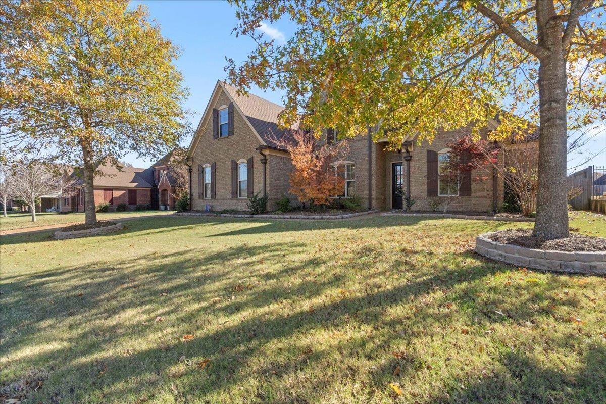 225 Estanaula Road Collierville, TN 38017 - Photo 4 of 38 a front view of a house with a yard