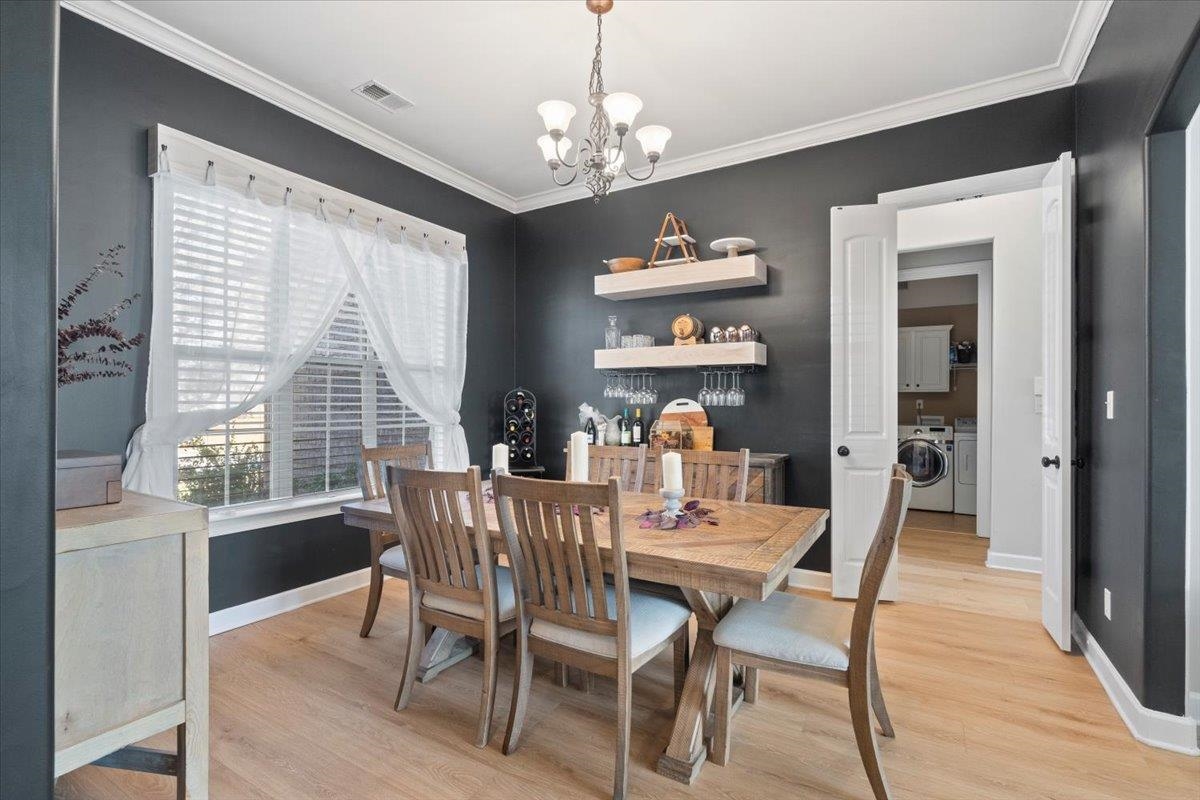 225 Estanaula Road Collierville, TN 38017 - Photo 9 of 38 a view of a dining room with furniture window and outside view