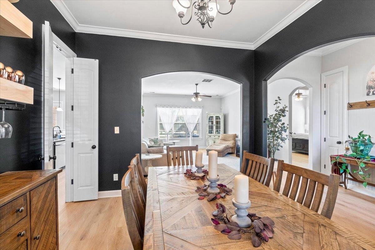 225 Estanaula Road Collierville, TN 38017 - Photo 10 of 38 a view of a dining room with furniture window and wooden floor